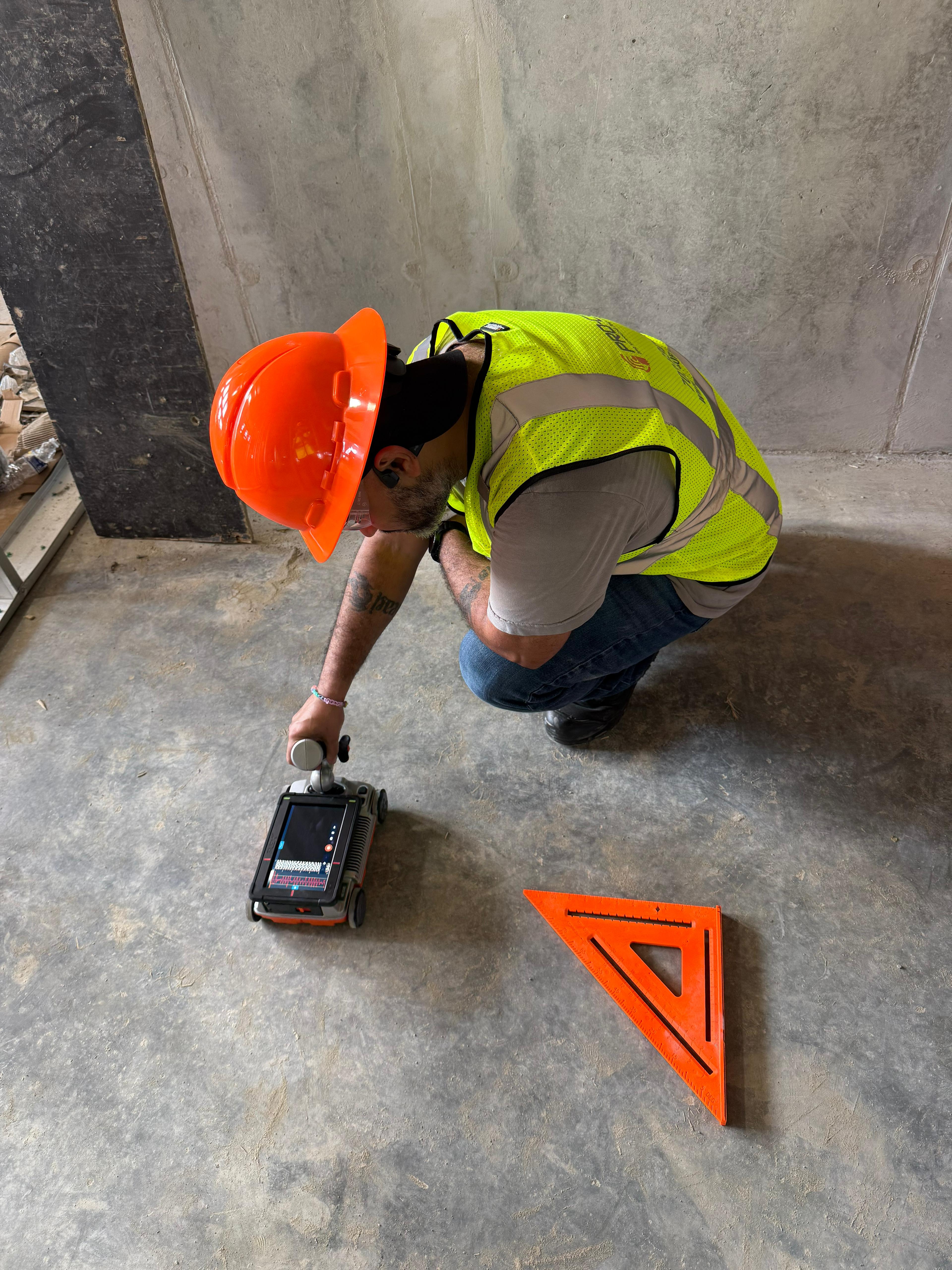 Pro Core GPR technician operating ground-penetrating radar equipment on a concrete surface in Sterling, Virginia